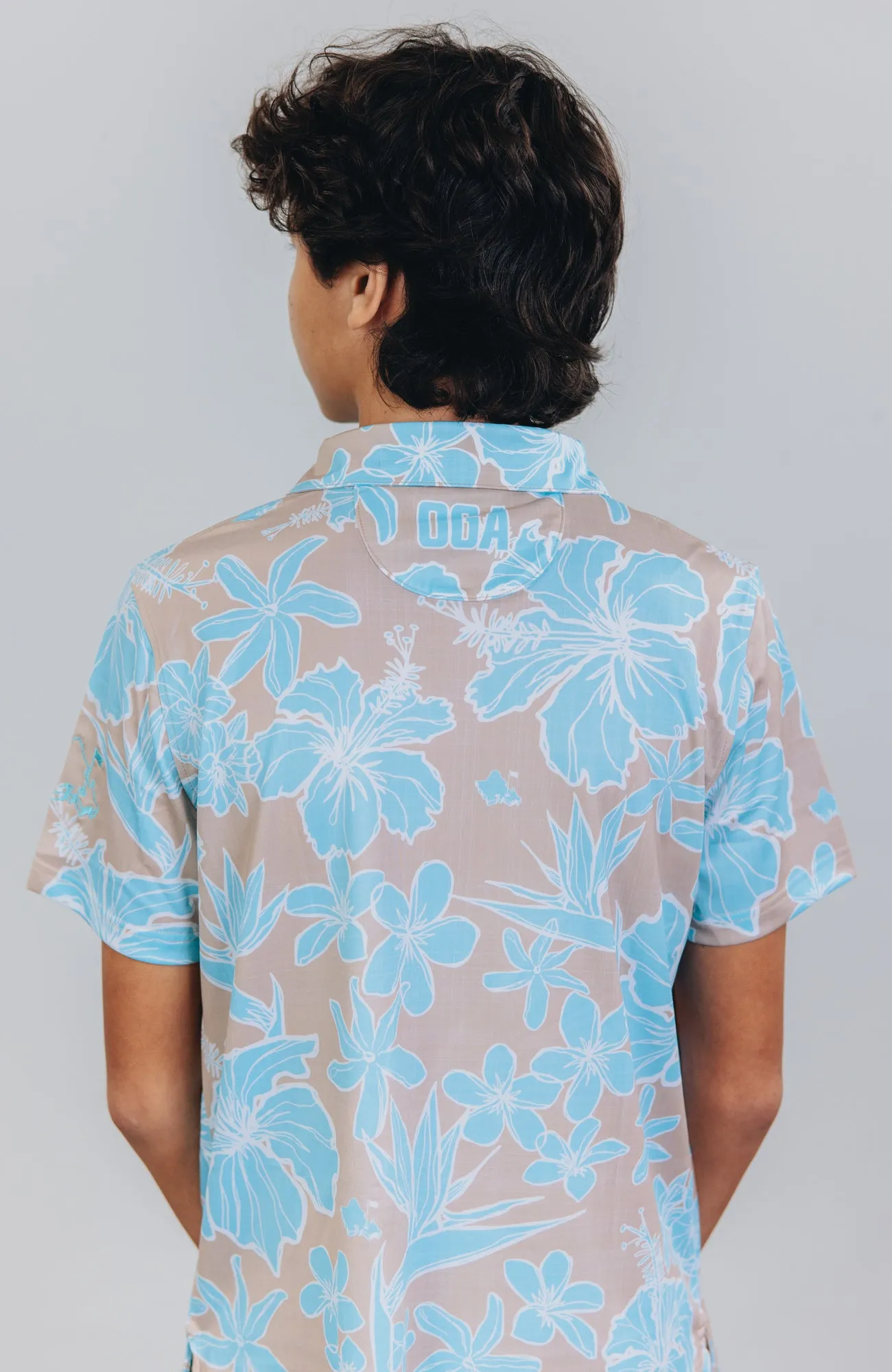 "Sketchy Floral Sandy Aqua" - OGA Youth Polo - Sand and Aqua